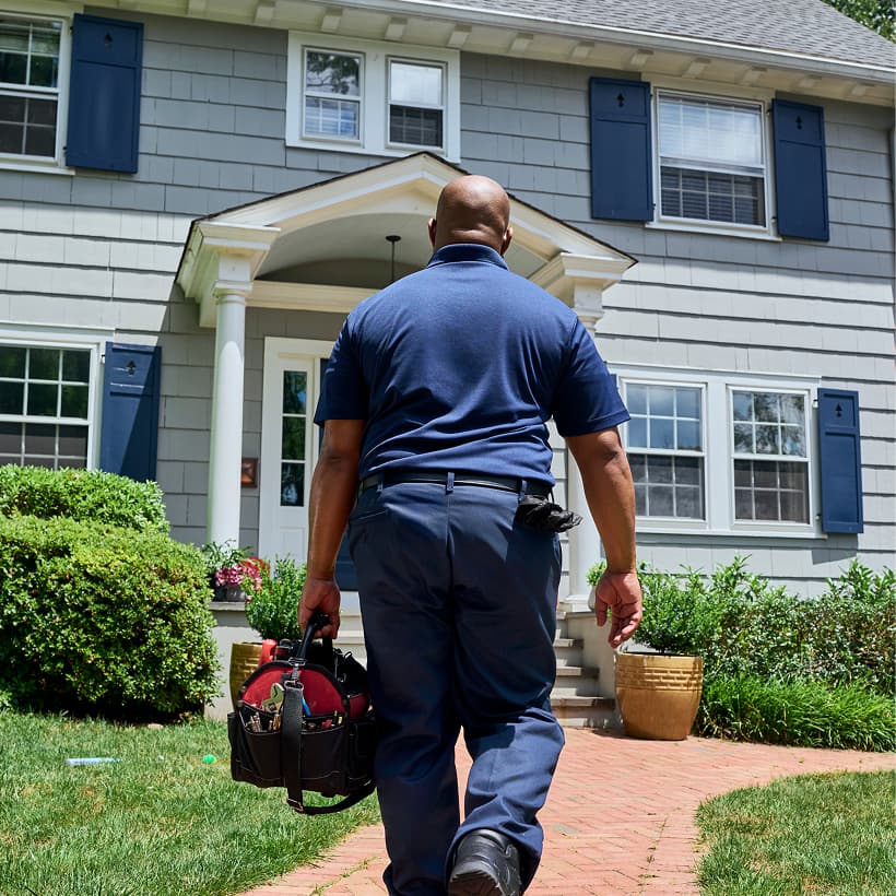 A Nicholson technician arrives at a home ready to provide expert HVAC, plumbing, and electrical services.