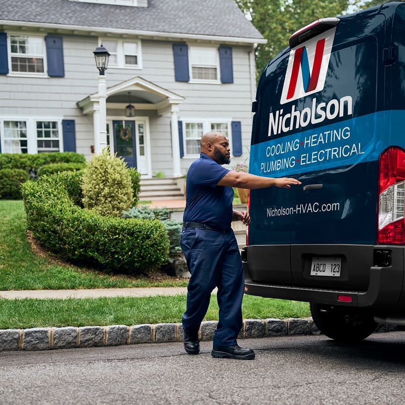 A Nicholson technician arrives at a home ready to provide expert HVAC, plumbing, and electrical services.